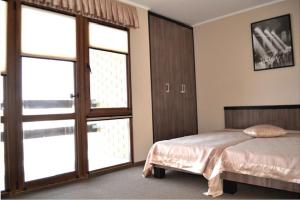 Posteľ alebo postele v izbe v ubytovaní Dergachov Guest House