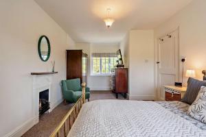 En eller flere senge i et værelse på Toad Hall