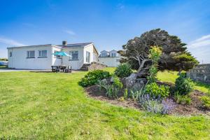 a house with a garden in front of it at Heavenly View in Southerndown