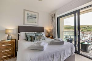 Ένα ή περισσότερα κρεβάτια σε δωμάτιο στο Beach Retreat - W6 +19 φωτογραφίες