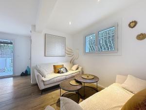 a living room with a couch and a table at HorizSky Villa, 6p, 3BR, pool, WiFi in Saint-Raphaël +51 photos