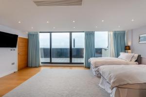 Ένα ή περισσότερα κρεβάτια σε δωμάτιο στο The Penthouse - Hythe