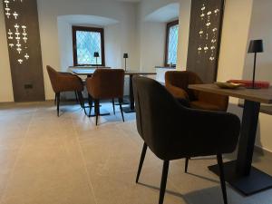 a waiting room with a table and chairs at 4 Elements Glamping & Apartments in Bled