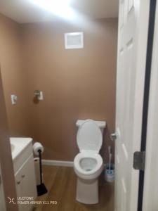 a bathroom with a toilet and a sink at Large downtown home in Philipsburg +12 photos