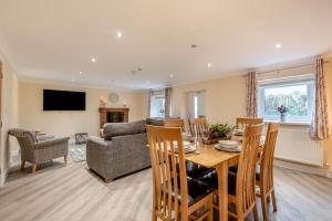 a living room with a table and a couch at Isel Gate Cottage in Sunderland
