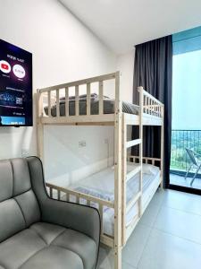 a living room with two bunk beds and a couch at 13th FL-The Podium-Studio-Free 1 Parking-6 Pax in Kuching +22 photos