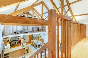 an overhead view of a kitchen and living room with wooden beams at The Moohey in Downderry
