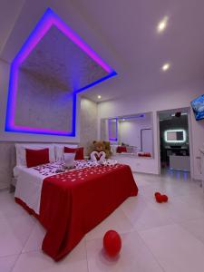 a bedroom with a bed with a teddy bear on it at Il Deseo Suite con vasca idromassaggio in Monteparano