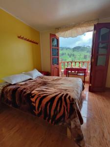 Ένα ή περισσότερα κρεβάτια σε δωμάτιο στο Hotel Tambo del Inca