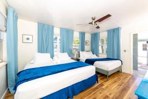 Ένα ή περισσότερα κρεβάτια σε δωμάτιο στο Tropic Isle Boutique Hotel