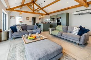 a living room with two couches and a table at 3 Bed in Wendron oc-w29093 in Wendron