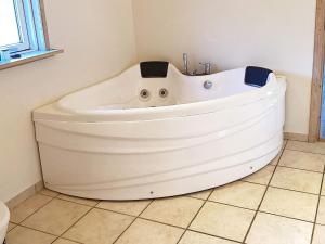 a large white bath tub in a bathroom at 10 person holiday home in Væggerløse-By Traum in Marielyst