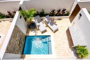 an overhead view of a swimming pool on a house at ZenBreak Azzurro 9, 2bd in Saint James