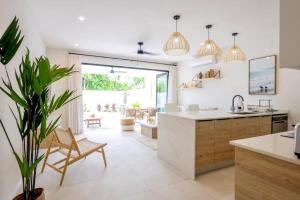 a kitchen with a sink and a counter top at ZenBreak Azzurro 9, 3bd in Saint James