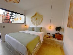 Ένα ή περισσότερα κρεβάτια σε δωμάτιο στο Casa Guru Villa Canggu