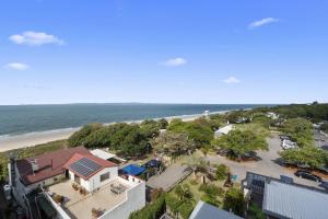 an aerial view of a beach with a house at The Seagulls Nest Woorim in Woorim