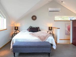 a bedroom with a bed and two lamps and a window at 4 star holiday home in Onsala in Onsala