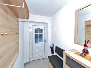 a kitchen with white walls and a white door at Chalet in Wald near Zillertal Ski Area in Wald im Pinzgau