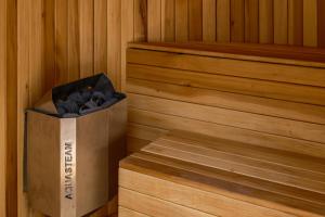 a box of charcoal is sitting in a sauna at Cholula Condesa Hotel by Lumina in Mexico City +49 photos