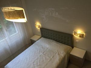 Postel nebo postele na pokoji v ubytování Affittacamere La Perla