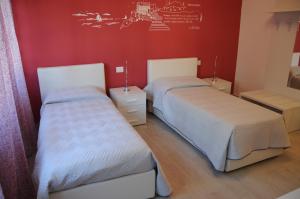 Postel nebo postele na pokoji v ubytování Affittacamere La Perla