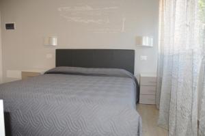 Postel nebo postele na pokoji v ubytování Affittacamere La Perla
