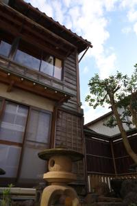 a fire hydrant in front of a house at Fukunosumika - Vacation STAY 80596v in Nanto