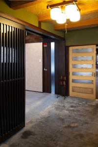 an empty garage with a sliding door and a hallway at Fukunosumika - Vacation STAY 79782v in Nanto +22 photos