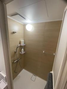 a shower with a glass door in a bathroom at Rusutsu Golf&Ski Lodge - Vacation STAY 18169 in Rusutsu