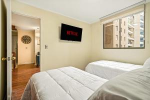 En eller flere senge i et værelse på Estreno Barrio Turístico - Piscina + 8 billeder