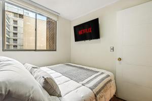 En eller flere senge i et værelse på Estreno Barrio Turístico - Piscina