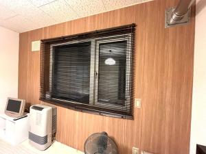 a room with a window with a heater and a fan at Maison Loire - Vacation STAY 18226 in Hakodate
