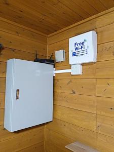 a refrigerator with a free wifi sign on a wall at Shiobara Onsen Activity Club - Vacation STAY 86346v in Shiobara-machi