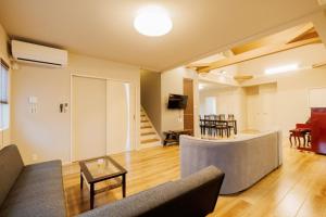 a living room with a couch and a table at Variety Road Bette Gento - Vacation STAY 83175v in Kawasaki