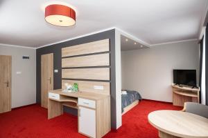 TV a/nebo společenská místnost v ubytování Elba Hotel