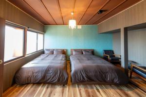 En eller flere senge i et værelse på VILLA THE RISE HAKODATE - Vacation STAY 84034v + 47 billeder