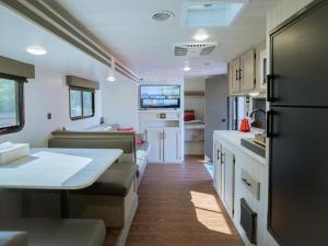 a kitchen and living room of an rv at Gramercy Village Lake Yamanaka Glamping & Sauna - Vacation STAY 92837v in Yamanakako +10 photos