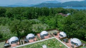 an aerial view of a house with domes at Gramercy Village Lake Yamanaka Glamping & Sauna - Vacation STAY 92837v in Yamanakako