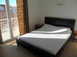 Postel nebo postele na pokoji v ubytování Apartments Leut