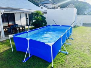 a large blue pool in the backyard of a house at DOG LEG - Vacation STAY 98415v in Funakata