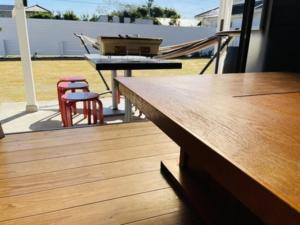 a deck with a table and two stools and a grill at DOG LEG - Vacation STAY 98415v in Funakata +8 photos