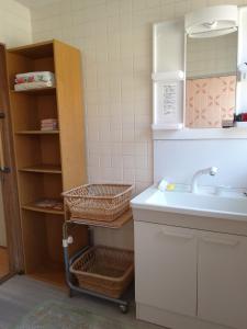 a small kitchen with a sink and a shelf at Yoshinogawa - House - Vacation STAY 98531v in Yoshinogawa