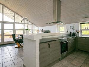 a kitchen with a counter and a stove top oven at 4 star holiday home in Skals in Skals