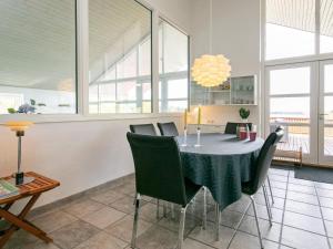 a dining room with a table and chairs at 4 star holiday home in Skals in Skals