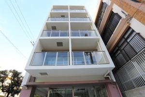 a tall building with windows on the side of it at Tabi no Teitaku Okinawa Naha - Vacation STAY 91264v in Naha