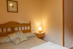 Posteľ alebo postele v izbe v ubytovaní Hostal Aiguamog