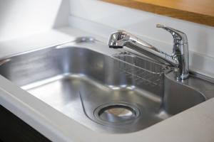 a stainless steel sink with a faucet in a kitchen at HANA - Vacation STAY 18403 in Nagoya +38 photos