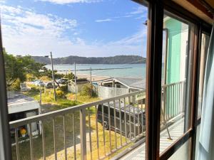 a view of the ocean from a balcony at kupono - Vacation STAY 00621v in Minamiboso