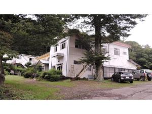 a white house with a tree in front of it at Shintaku Sanso - Vacation STAY 27204v in Kunizakai