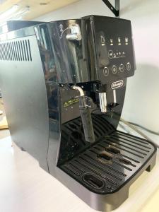 a black espresso machine sitting on top of a counter at Svalbard Residence - Vacation STAY 18446 in Minamifurano